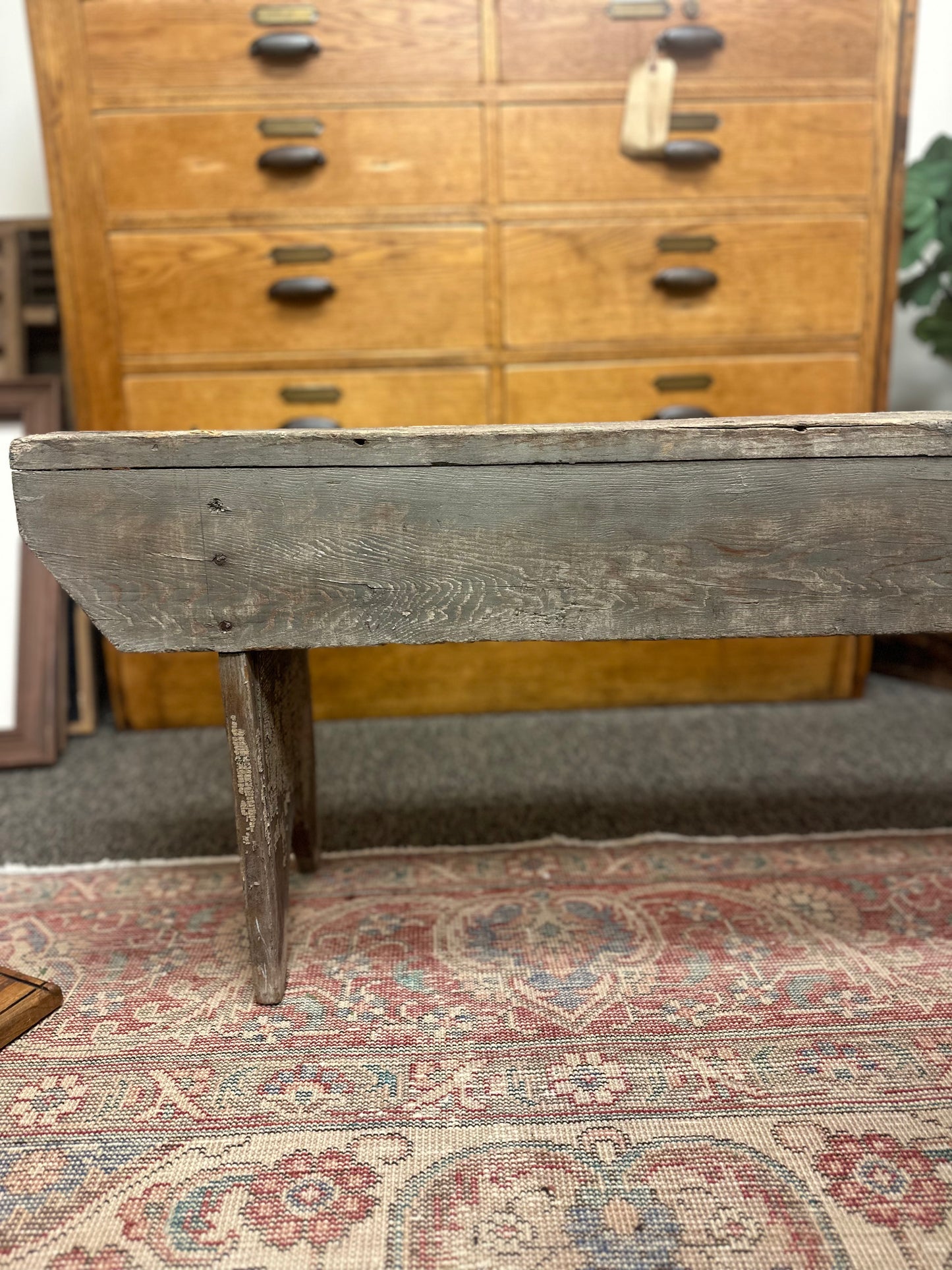 Found primitive bench with handle carved in middle