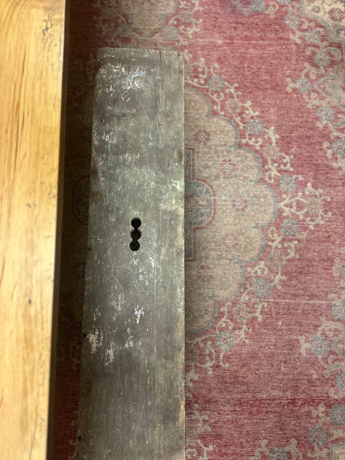 Found primitive bench with handle carved in middle